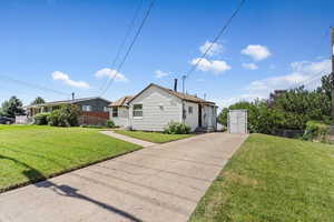 View of front of home featuring concrete driveway and entry steps. Two car tandem parking with on street parking available.