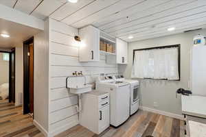 Laundry room, light wood-style floors, and recessed lighting. Drain in floor. Bright natural lighting. Access to back patio and yard. Washer and Dryer not included.