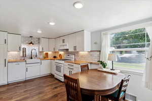 Custom kitchen with butcher block countertops. Views of the mountains from the eat in kitchen. Bright and spacious.