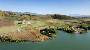 View of rural area with property parcel outlined and a water and mountain view