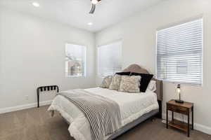 Carpeted bedroom featuring recessed lighting and ceiling fan
