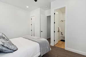 Carpeted bedroom with recessed lighting, ensuite bath, and a ceiling fan