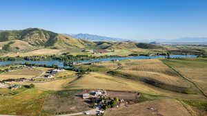 Aerial view of property's location with a water and mountain view