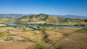 Aerial overview of property's location with a water and mountain view