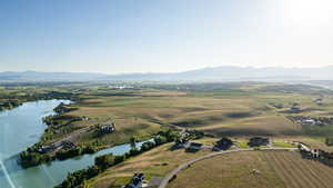 Aerial view of property's location featuring a water and mountain view and rural landscape