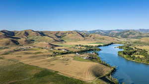 Aerial overview of property's location with a water and mountain view