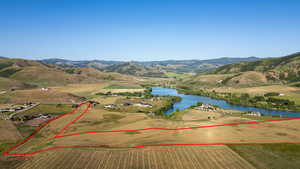 View of property location featuring a water and mountain view and property boundaries highlighted