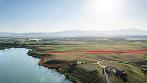 Aerial overview of property's location featuring a water and mountain view and property boundaries highlighted