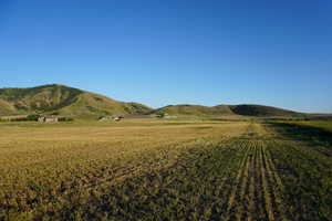 View of mountain background featuring rural landscape