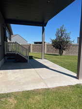 Fenced backyard with a patio area