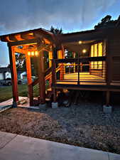 Back of house with a wooden deck