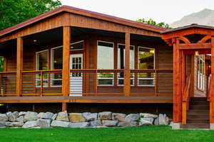 Back of house featuring a mountain view