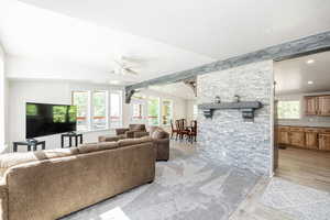 Living area with recessed lighting, ceiling fan, and light wood-type flooring