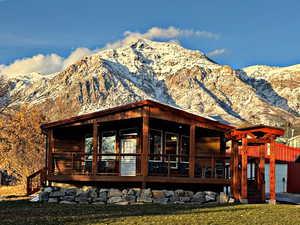 Back of property with a mountain view