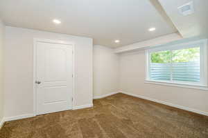Spare room with carpet flooring and recessed lighting