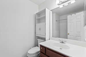 Bathroom featuring toilet and vanity