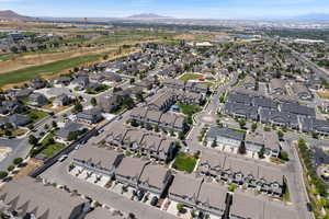 Aerial overview of property's location featuring a mountain backdrop and nearby suburban area