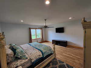 Bedroom featuring recessed lighting, light wood finished floors, and a ceiling fan