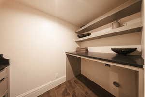 Interior space featuring cabinet space and wood tiled floors