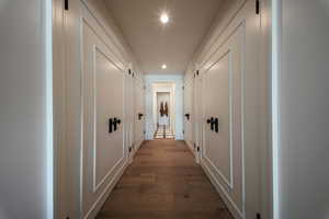 Corridor featuring recessed lighting and dark wood-style flooring
