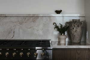 Kitchen view of stove and backsplash