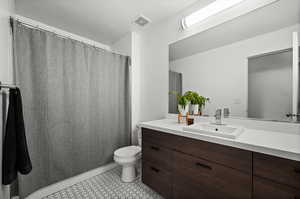 Bathroom with vanity and toilet