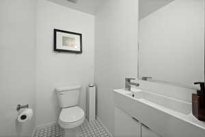 Half bath with toilet and vanity