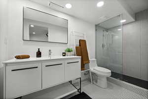 Full bath featuring vanity, walk in shower, recessed lighting, and tile patterned floors