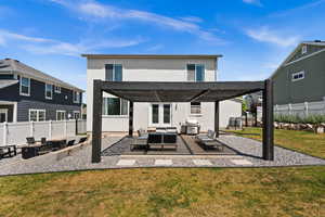 Back of house with outdoor lounge area, a patio, stucco siding, and a pergola