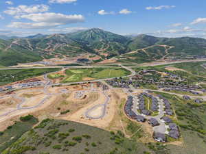 Aerial view of property's location with a mountainous background