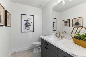 Bathroom featuring vanity and tile patterned flooring