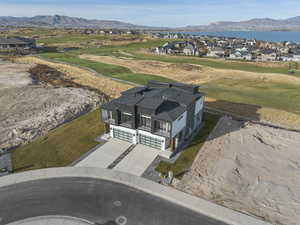 Aerial view of residential area with a water and mountain view and a golf club