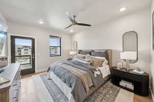 Bedroom with light wood finished floors, access to outside, a ceiling fan, and recessed lighting