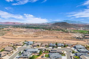 Aerial view of residential area featuring a mountain backdrop