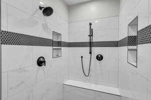Full bathroom featuring a tile shower