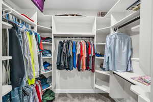 Walk in closet featuring carpet floors
