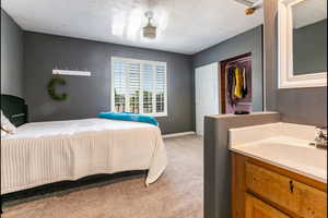 Jack and Jill bedroom 2 of 2 with light carpet and a closet