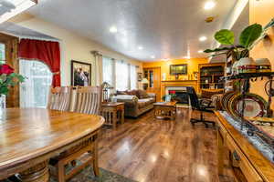 Living area featuring recessed lighting, wood finished floors, and a fireplace
