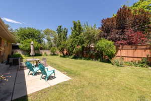 Fully fenced backyard.  Great patio off dining room for entertaining.