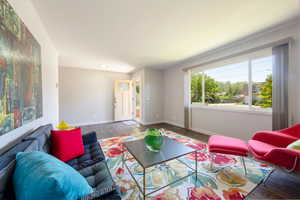 Living room featuring wood finished floors and baseboards