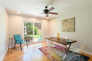 Dining area featuring ceiling fan, light wood-style floors, and recessed lighting