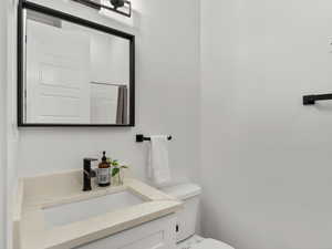 Full bathroom featuring vanity and toilet