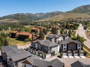 Aerial perspective of suburban area featuring a mountain backdrop