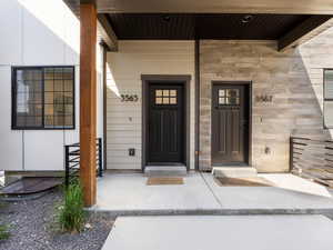 View of exterior entry with covered porch