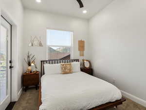 Carpeted bedroom with recessed lighting and a ceiling fan