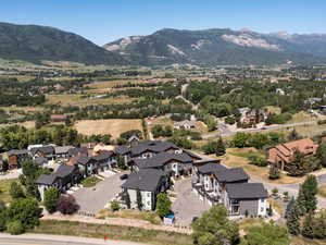 Aerial perspective of suburban area featuring a mountain backdrop
