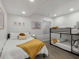 Carpeted bedroom with recessed lighting and baseboards