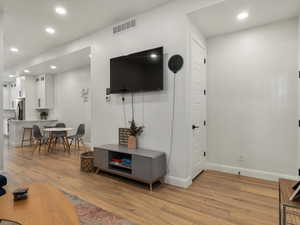 Living area featuring recessed lighting and light wood finished floors