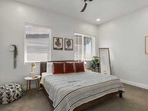 Bedroom with carpet flooring, ceiling fan, and recessed lighting