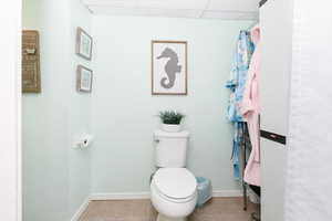 Bathroom with toilet and tile patterned floors